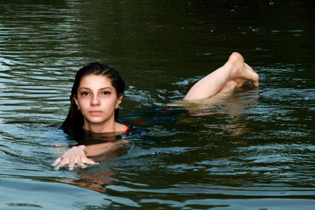 pretty girl floats in water